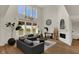 Bright living room with vaulted ceilings, large windows, and stylish modern decor at 16683 Alex Dr, Noblesville, IN 46060