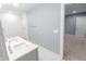 View of modern bathroom featuring double sink vanity, and white tiled shower at 1723 Fletcher Ave, Indianapolis, IN 46203