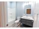 Modern bathroom with sleek vanity, stylish faucet, and bathtub with shower, designed for comfort at 1723 Fletcher Ave, Indianapolis, IN 46203