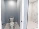 Modern bathroom with a toilet next to the doorway entrance of a spacious shower at 1723 Fletcher Ave, Indianapolis, IN 46203