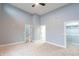 Spacious bedroom with carpet flooring, two closets, and multiple entryways to other rooms at 1723 Fletcher Ave, Indianapolis, IN 46203