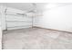Spacious garage with high ceilings and a bright white garage door at 1723 Fletcher Ave, Indianapolis, IN 46203