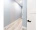 Long hallway with light wood floors and neutral walls, offering a clean and bright passageway through the home at 1723 Fletcher Ave, Indianapolis, IN 46203