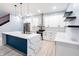 Modern kitchen featuring a large island with quartz countertop, white cabinets, and stainless steel appliances at 1723 Fletcher Ave, Indianapolis, IN 46203