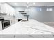 Modern kitchen with a large island, stainless steel appliances, and light countertops that offer ample counter space at 1723 Fletcher Ave, Indianapolis, IN 46203