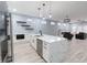 Modern kitchen with a large island, stainless steel appliances, and an open-concept layout to the living area at 1723 Fletcher Ave, Indianapolis, IN 46203