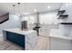 Beautiful kitchen featuring a large island with quartz countertop, white cabinets, and stainless steel appliances at 1723 Fletcher Ave, Indianapolis, IN 46203