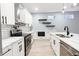 Bright kitchen with white cabinets, stainless steel appliances, and a spacious island with quartz countertops at 1723 Fletcher Ave, Indianapolis, IN 46203