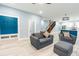 Open-concept living room with stylish furniture, blue accent wall and modern finishes at 1723 Fletcher Ave, Indianapolis, IN 46203