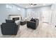 Cozy living room featuring stylish furniture, fireplace, and ample natural light at 1723 Fletcher Ave, Indianapolis, IN 46203