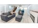 Spacious living room flowing into kitchen, complete with modern fireplace and seating at 1723 Fletcher Ave, Indianapolis, IN 46203