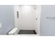 Close up of modern white tiled shower with black mosaic tile floor at 1723 Fletcher Ave, Indianapolis, IN 46203