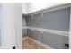 Bright walk-in closet with shelves and a rod, providing neat storage for an organized space at 1723 Fletcher Ave, Indianapolis, IN 46203