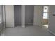 A bedroom featuring sliding closet doors, a window, and modern gray walls, offering a serene atmosphere at 17458 Ebling Trl, Westfield, IN 46062