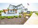 Welcome to Bonterra: a beautiful, new construction community with a decorative entrance and lush landscaping at 17458 Ebling Trl, Westfield, IN 46062