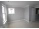 Bright bedroom with ample natural light from two windows and neutral walls offers a serene space at 17466 Ebling Trl, Westfield, IN 46062