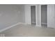 Bedroom with two closets and neutral walls is ready for customization and personal touches at 17466 Ebling Trl, Westfield, IN 46062