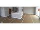 Unfinished living room showcases bright natural light through sliding glass door, ready for customization and personal touches at 17466 Ebling Trl, Westfield, IN 46062