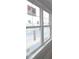 Close-up view of white framed window with protective film, showcasing natural light and clean lines at 17466 Ebling Trl, Westfield, IN 46062