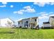 Expansive backyard featuring a well-manicured lawn, lush landscaping, and white exterior at 180 Oakhurst Way, Westfield, IN 46074