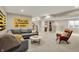 Finished basement with stylish seating and decor near a kitchenette and stairs at 180 Oakhurst Way, Westfield, IN 46074