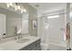 Bright bathroom featuring a shower-tub, white subway tile, modern vanity, and neutral paint at 180 Oakhurst Way, Westfield, IN 46074