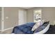 Cozy bedroom features a queen sized bed, a sliding-door closet, and a bright window at 180 Oakhurst Way, Westfield, IN 46074