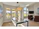 Bright dining area with modern lighting, large windows, and scenic water view at 180 Oakhurst Way, Westfield, IN 46074