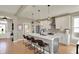 Stylish kitchen with a large island, modern appliances, and pendant lighting at 180 Oakhurst Way, Westfield, IN 46074