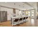 Bright, airy kitchen with a large island, seating, and views of the outdoor area at 180 Oakhurst Way, Westfield, IN 46074