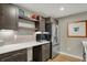 Beautiful kitchen with stainless steel fridge, spacious countertops, and ample modern cabinet space at 180 Oakhurst Way, Westfield, IN 46074