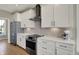Modern kitchen featuring white cabinets, stainless steel appliances, and quartz countertops at 180 Oakhurst Way, Westfield, IN 46074