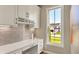 Bright office space with white cabinetry, quartz countertops, and natural light from a window at 180 Oakhurst Way, Westfield, IN 46074