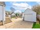 A spacious backyard with a detached garage and patio area perfect for outdoor entertaining and relaxation at 1865 N Norfolk St, Indianapolis, IN 46224