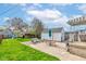 Spacious backyard featuring a large patio, lush green grass, and ample space for outdoor enjoyment at 1865 N Norfolk St, Indianapolis, IN 46224