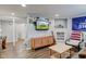 Entertaining basement area features a modern TV with stylish furniture and decor at 1865 N Norfolk St, Indianapolis, IN 46224