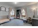 Bedroom featuring a crib, rocker, and soft natural light at 1865 N Norfolk St, Indianapolis, IN 46224