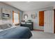 Bedroom features wood trim, plush carpet, and neutral paint at 1865 N Norfolk St, Indianapolis, IN 46224