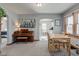 Dining room with piano and view to kitchen at 1865 N Norfolk St, Indianapolis, IN 46224