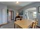 Light-filled dining room with adjacent bathroom and kitchen at 1865 N Norfolk St, Indianapolis, IN 46224
