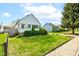 Charming home with well-maintained lawn and beautiful landscaping at 1865 N Norfolk St, Indianapolis, IN 46224