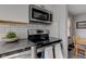 Updated kitchen featuring stainless steel appliances and modern finishes at 1865 N Norfolk St, Indianapolis, IN 46224