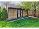 Outdoor storage shed providing ample space for tools and equipment alongside a lush green lawn at 1865 N Norfolk St, Indianapolis, IN 46224