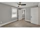 Large bedroom with ceiling fan, closet and natural light from the window at 207 S Arlington Ave, Indianapolis, IN 46219