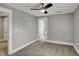 Neutral bedroom featuring a ceiling fan, carpet and ensuite bathroom at 207 S Arlington Ave, Indianapolis, IN 46219