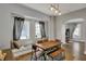 Bright dining room featuring a dining nook, hardwood floors, and neutral paint at 207 S Arlington Ave, Indianapolis, IN 46219