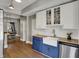 Renovated kitchen with butcher block countertops, white cabinets, and apron sink at 207 S Arlington Ave, Indianapolis, IN 46219