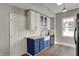 Charming kitchen features butcher block counters and bright white subway tile backsplash at 207 S Arlington Ave, Indianapolis, IN 46219