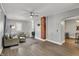 Cozy living room features hardwood floors, fresh paint, and comfortable seating at 207 S Arlington Ave, Indianapolis, IN 46219