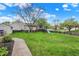 Grassy backyard featuring a play-set, white siding, and mature trees at 20777 Summitt Rd, Noblesville, IN 46062